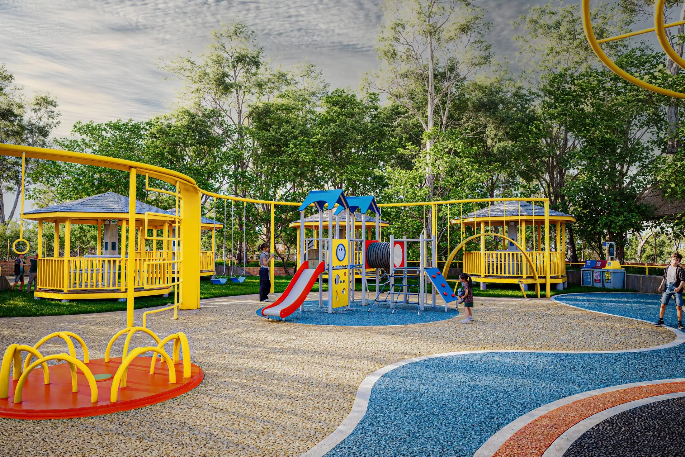 Children's playground with slides and yellow pergolas